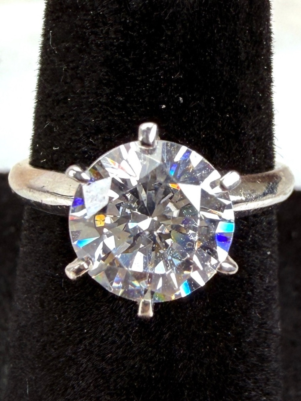 Beautiful size 4 3/4 silvertone, solitaire bling engagement ring